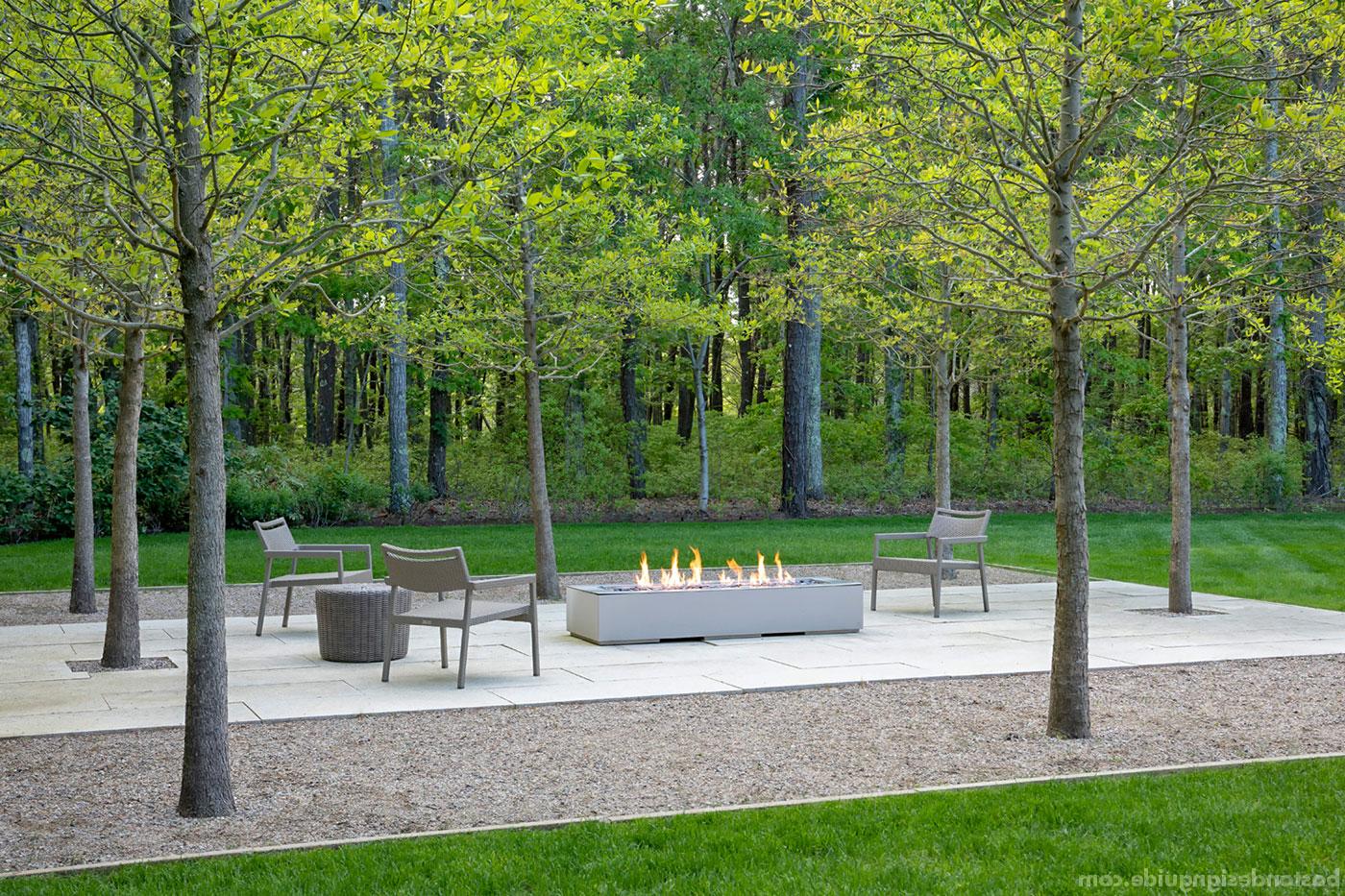 Contemporary grove-side fire feature for a 角 Cod landscape
